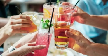 people toasting different drinks