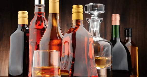 assortment of alcoholic beverage bottles